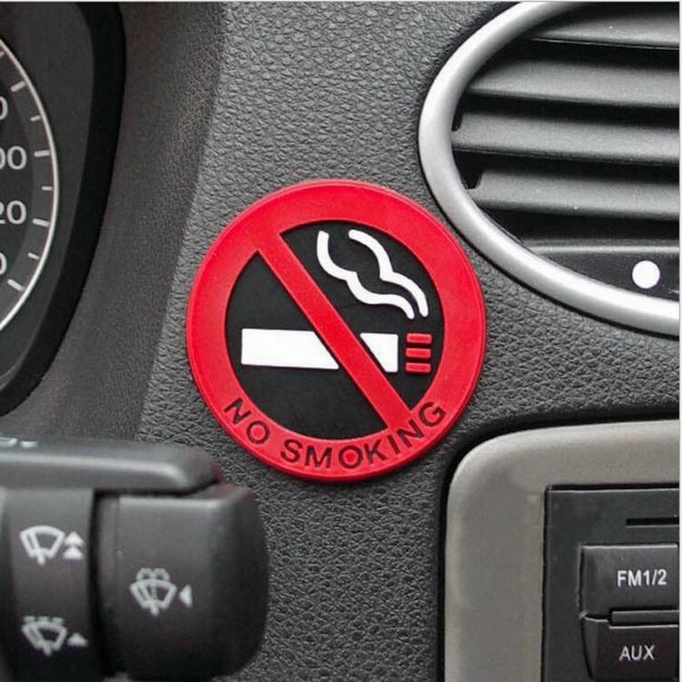 No smoking sign on a car dashboard