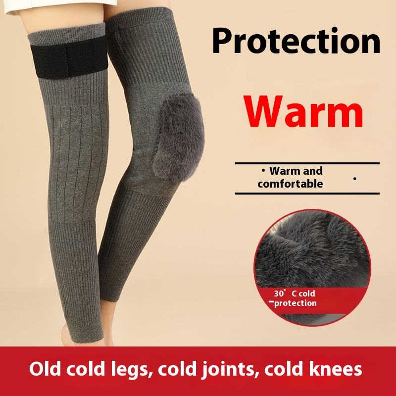 Gray knee-high socks with black bands on a beige background, emphasizing warmth and protection.