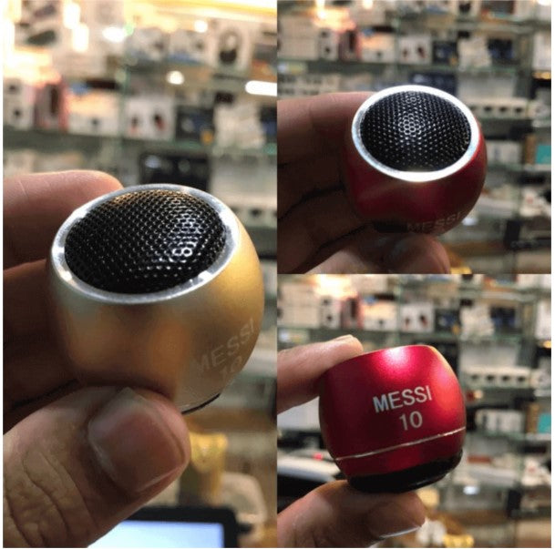 Small metallic and red objects with 'Messi' branding held in hands against a blurred store background.
