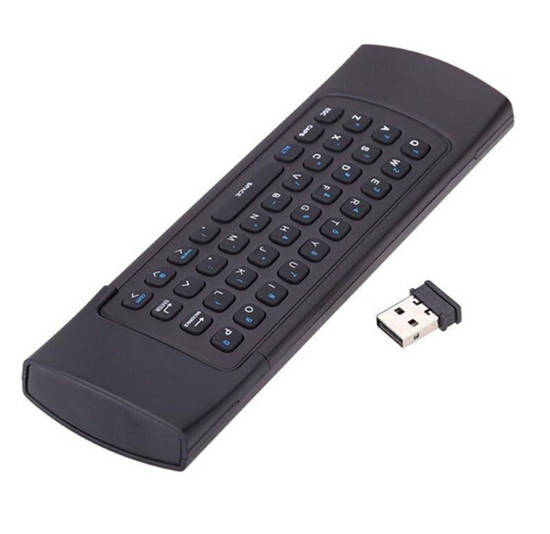 Black wireless keyboard remote control with USB receiver on a white background
